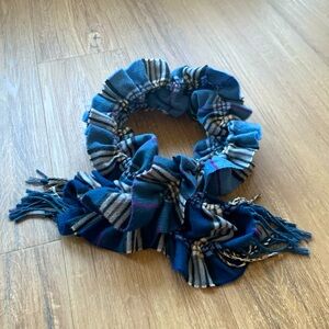 Cashmink Blue plaid stretch scarf. 38” x 7”.